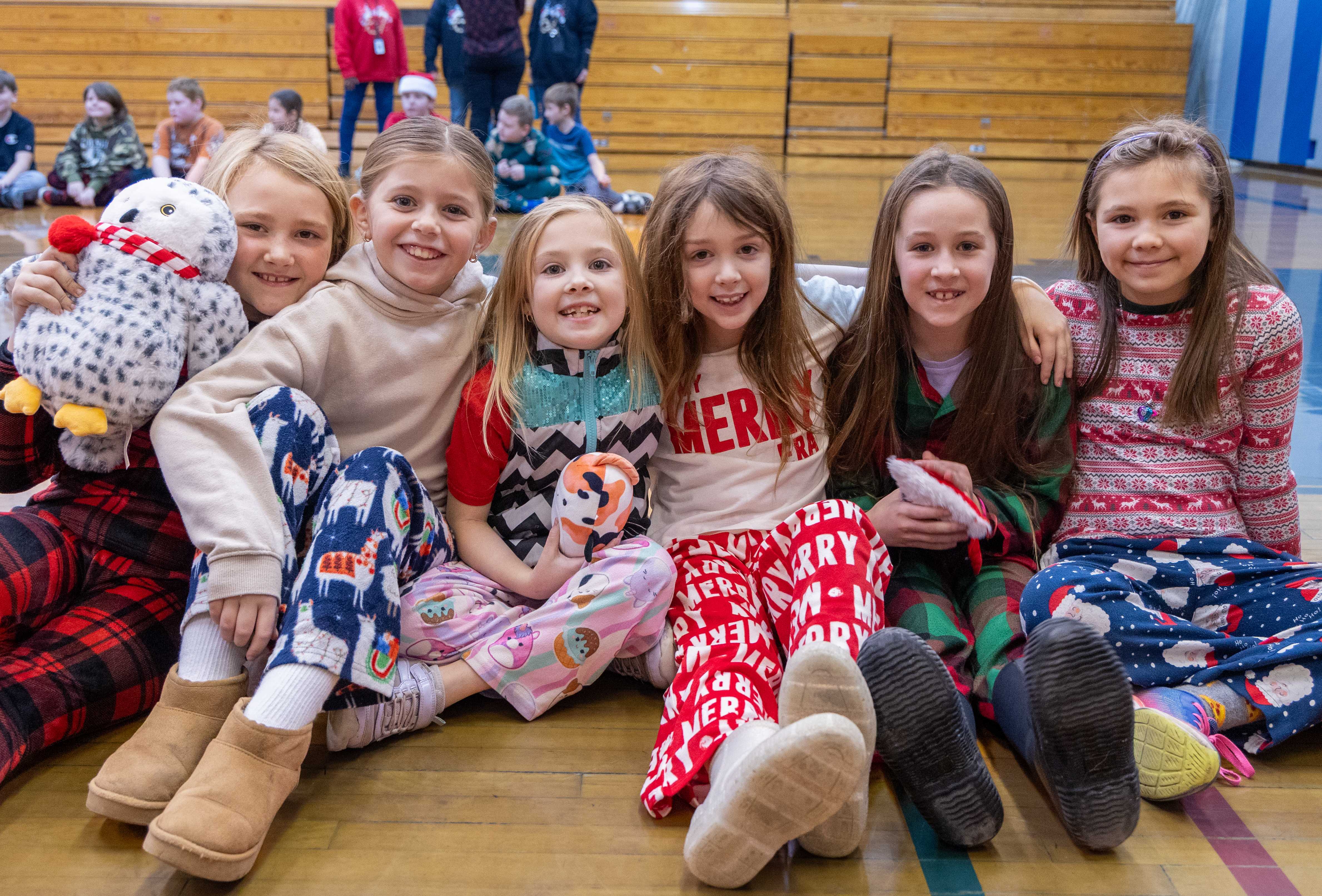 A group of Radez students smile for a picture